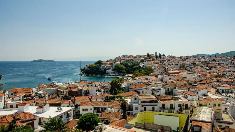 Skiathos Town and its harbour seen across terracotta rooftops
